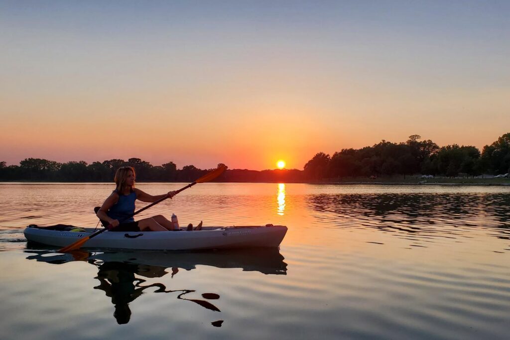 Kayaker on the water at sunset