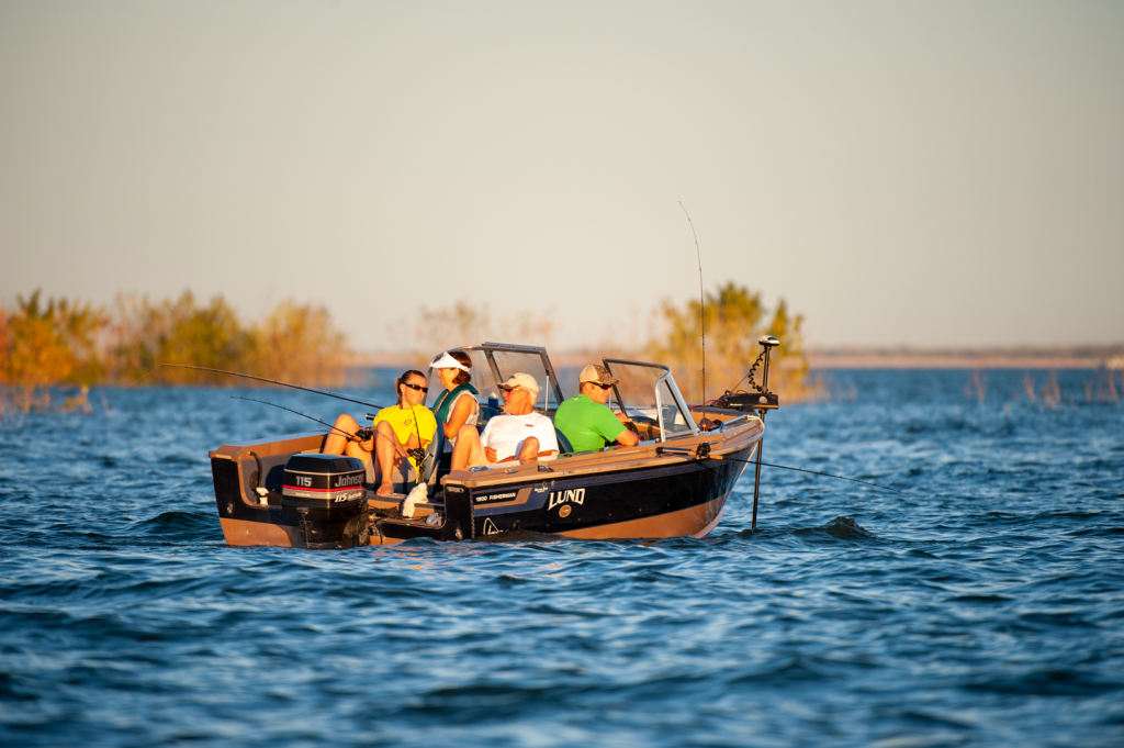 Anglers troll on a boat