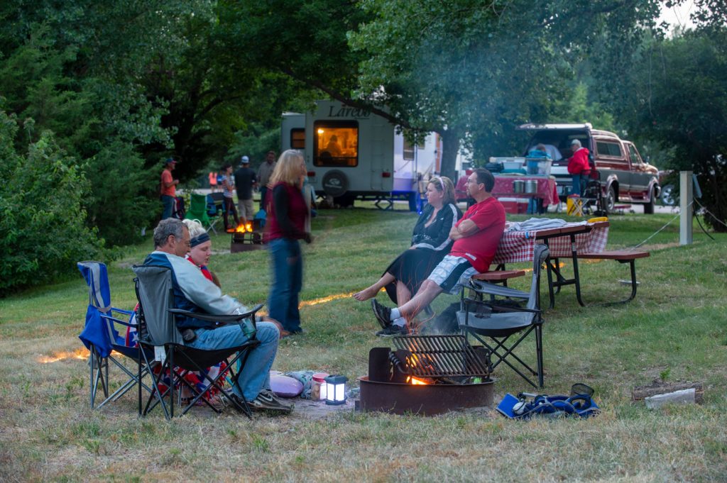 People sit around a campfire