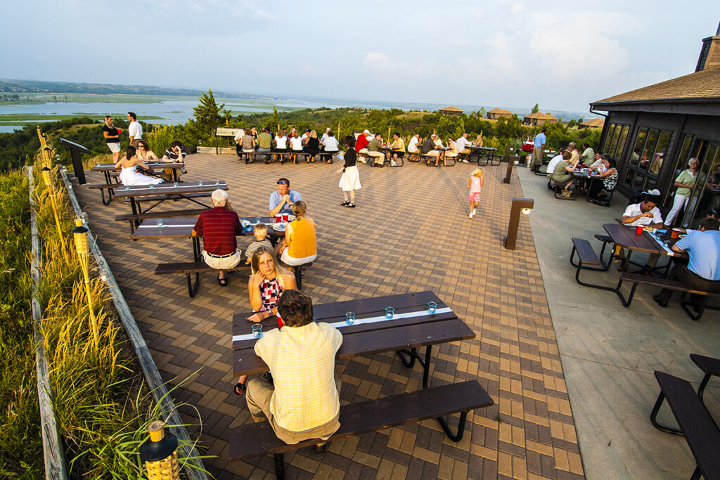 wedding guests enjoy the patio of the Niobrara State Park lodge that overlooks the river