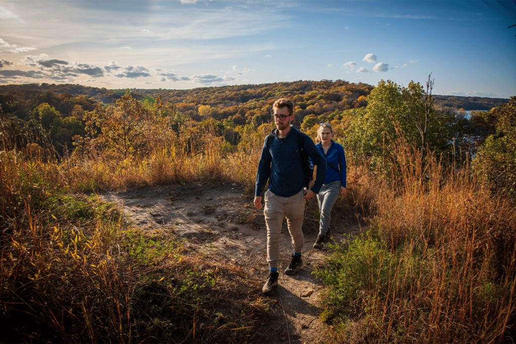 two people hiking a trail