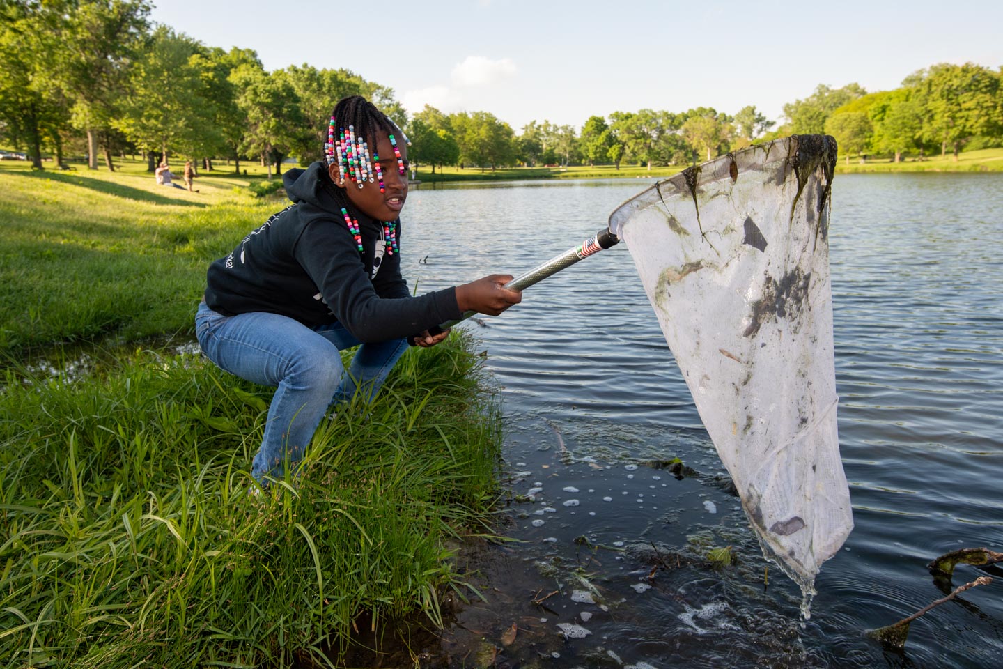 Checking the water for organisms at a bioblitz.