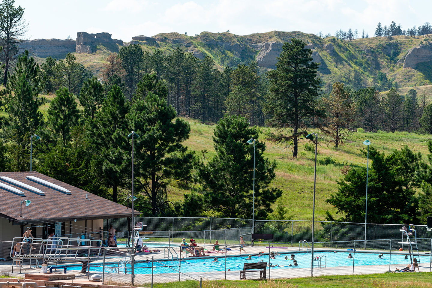 Swimmers cool off on a hot day the swimming pool at Chadron State Park.