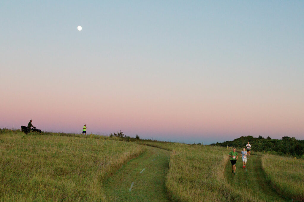 Competitive 5K runners in prairie