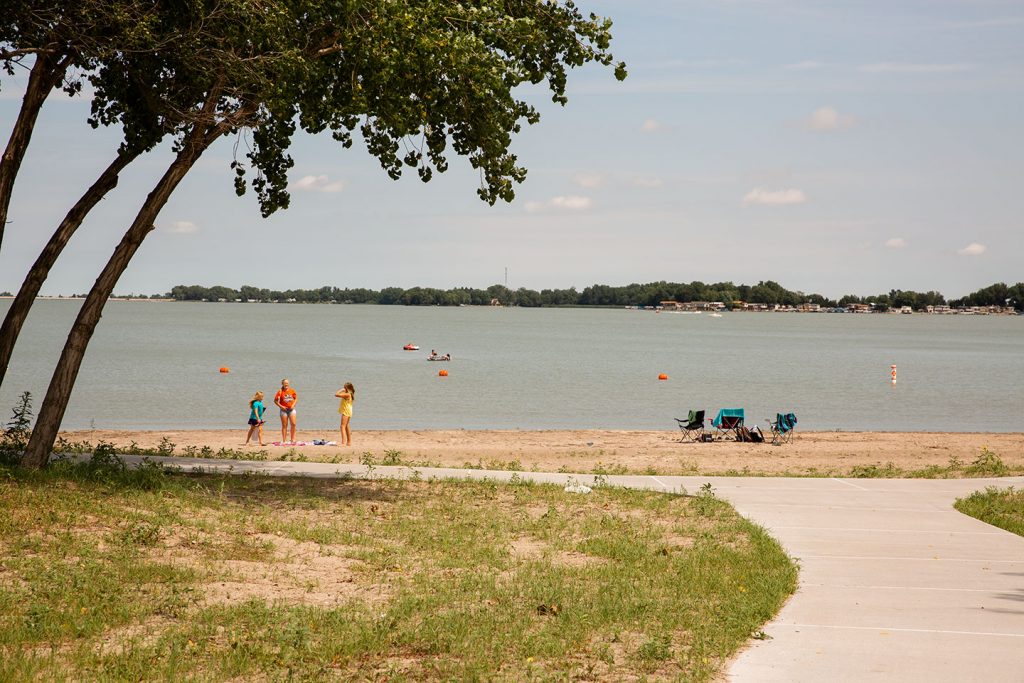 Visitors on the swimming beach at Lake Maloney SRA