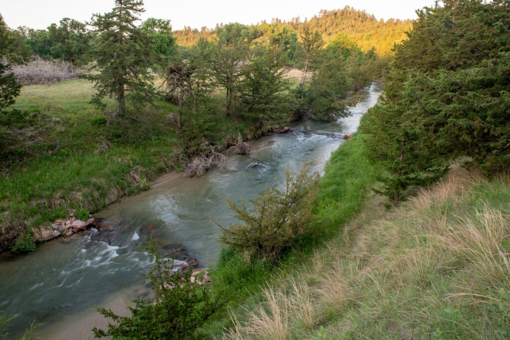 A photograph shows one of several rock structures installed in Long Pine Creek.